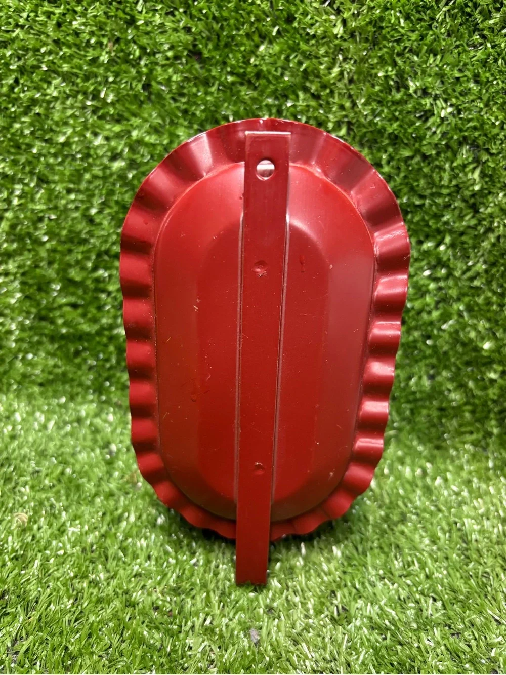 Red Primitive metal hanging candle holder with white candle